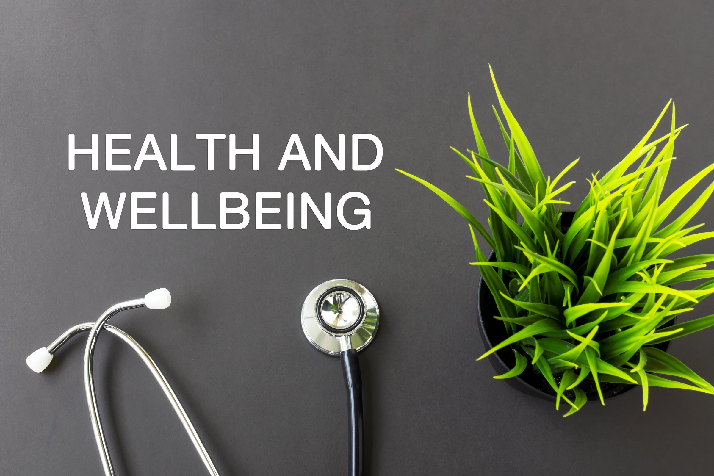 Health and well being text and stethoscope