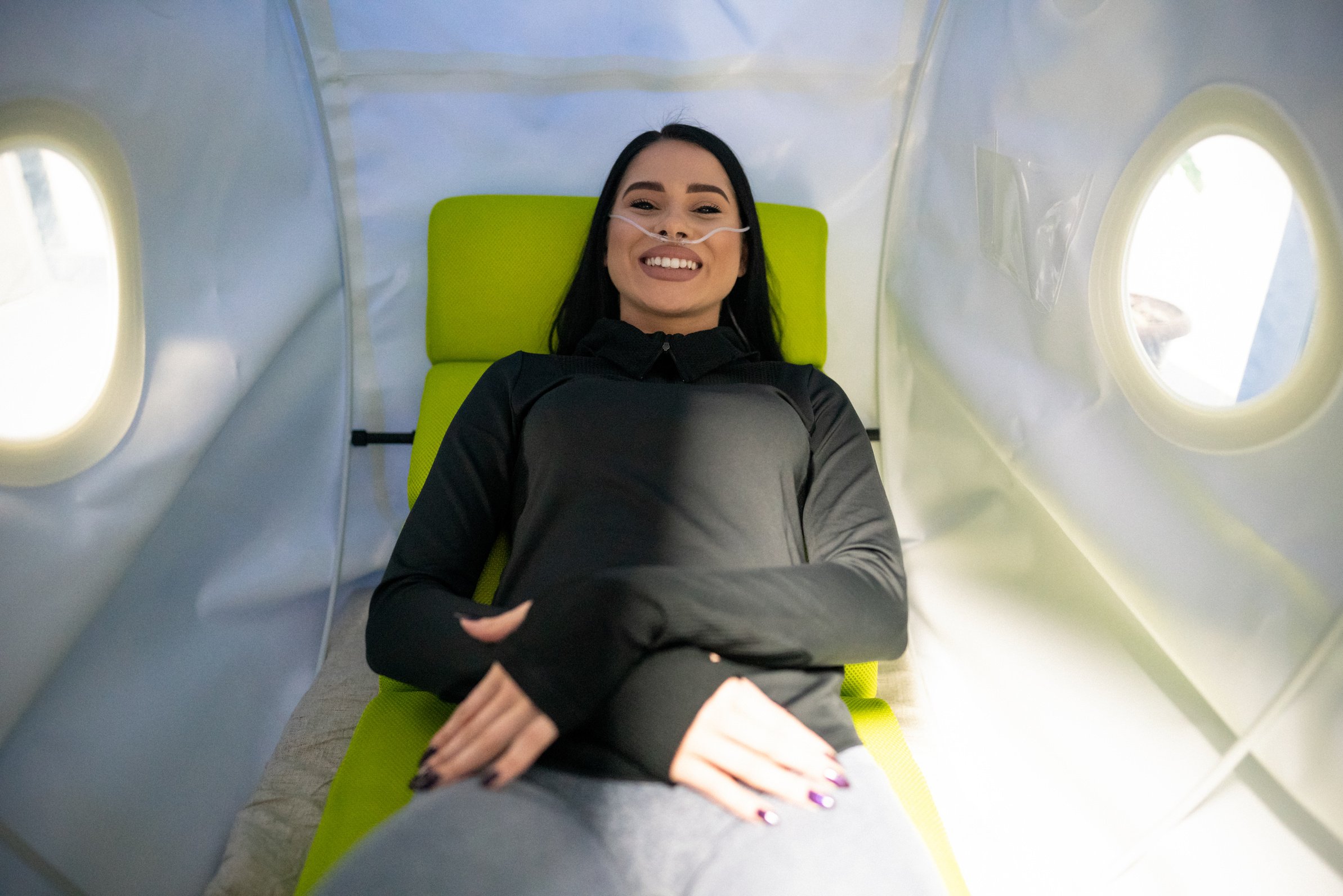 Young woman  on treatment in the hyperbaric oxygen chamber